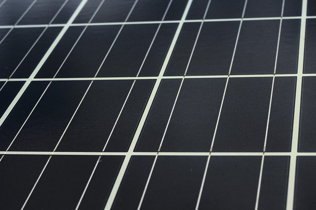 Tablet displaying AI energy management dashboard with solar production graphs and consumption metrics