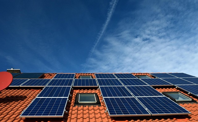 Solar panels installed on a flat-roof modern home in Calgary Alberta during winter with snow on the ground