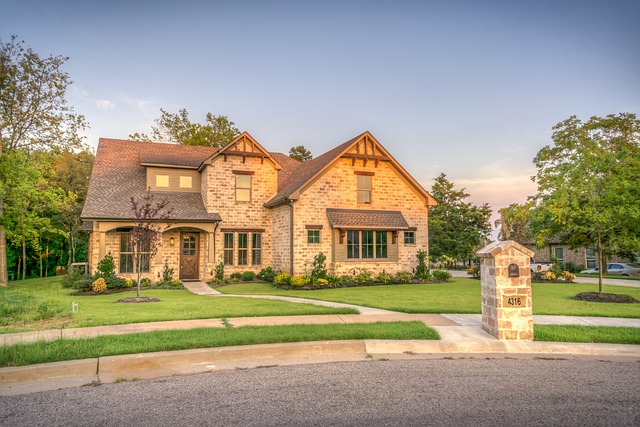Solar panels on Canadian suburban home with green lawn and trees